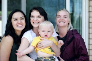 three women and a baby