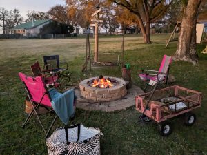 evening, chairs around a firepit