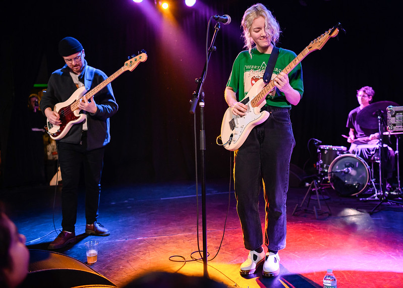 Band performing and playing guitars