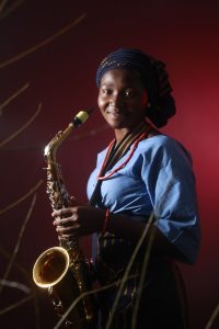 Girl holding a saxophone
