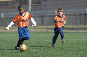 children playing soccer