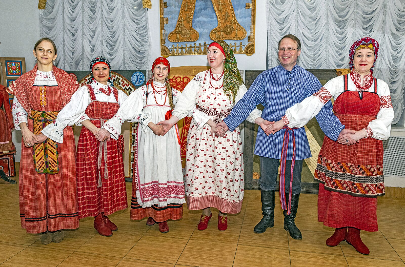 People wearing Russian traditional clothing