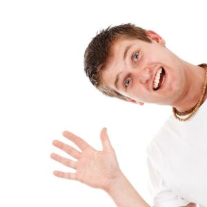 A young man is holding his hands out in front of him
