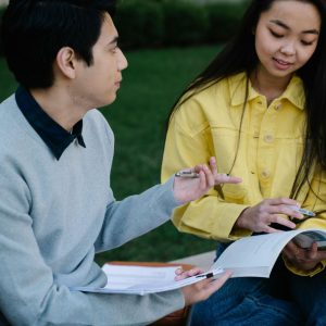 College Girl and Boy Studying Together