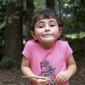 Young girl shrugging her shoulders
